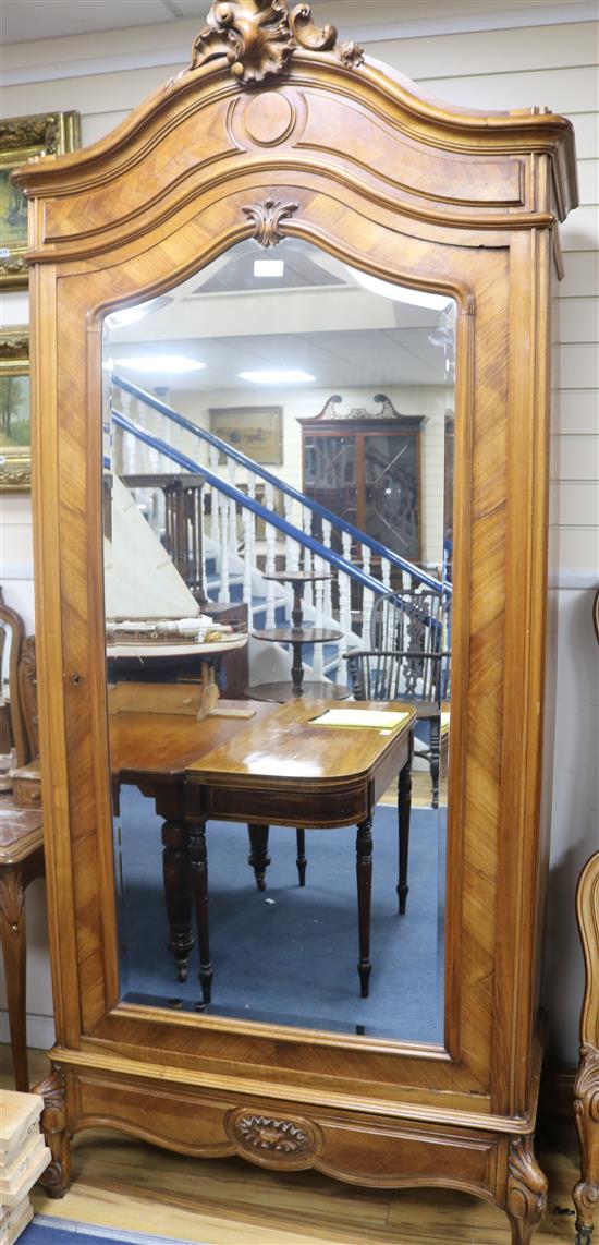 A near pair of early 20th century French walnut armoires, W.108cm, H.237cm, W.108 cm H.243cm